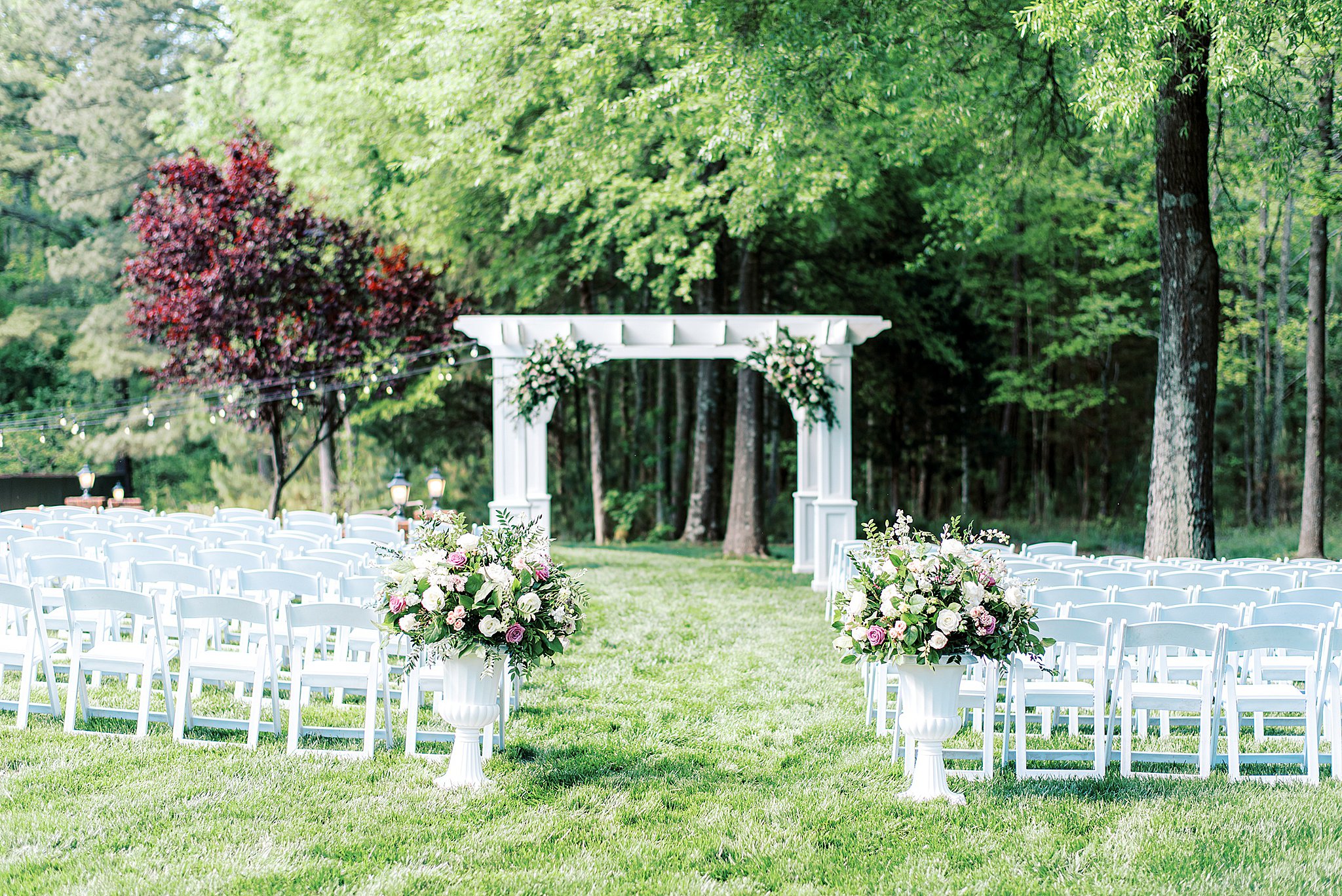 Details of a wedding ceremony setup in a grassy field
