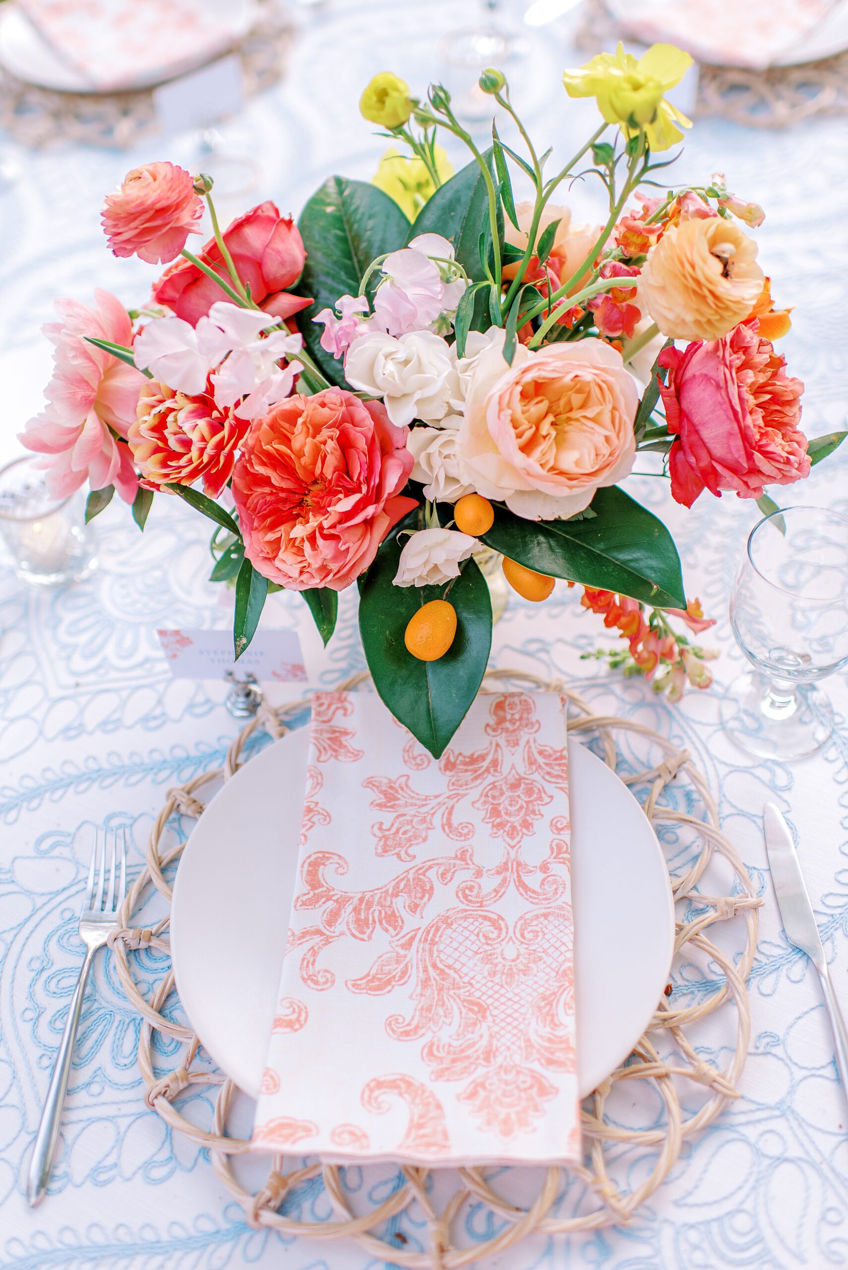 Details of a wedding reception table setting with pink carnations The grande victorian