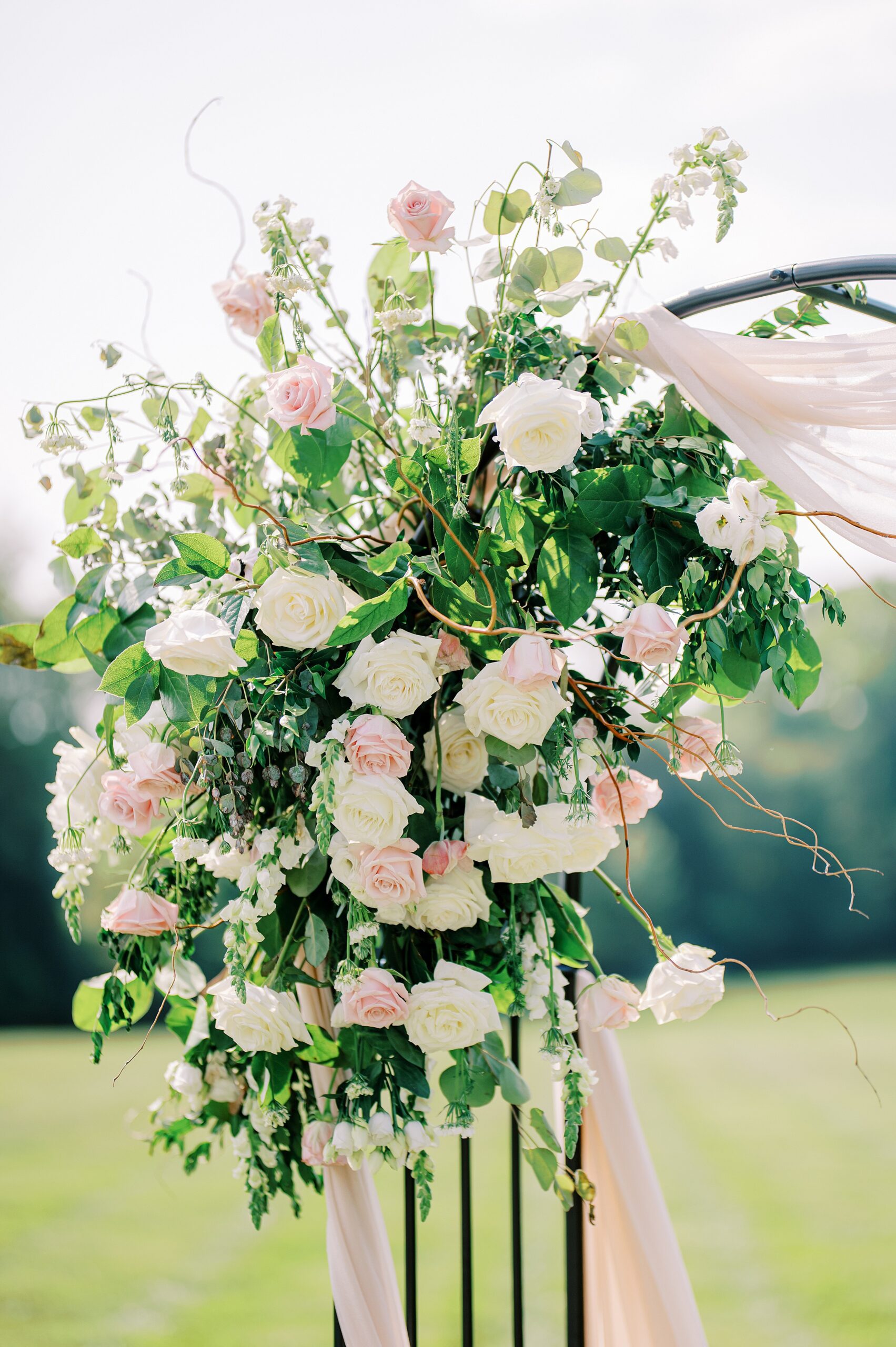 Details of a wedding ceremony floral decoration of white and pink roses